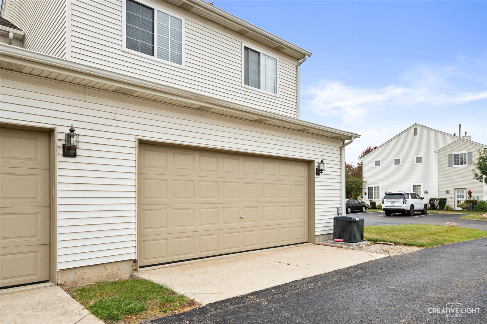 179 Azalea Circle, Unit 179 Romeoville, IL 60446 - Photo 16 of 16 a view of a white house with a outdoor space