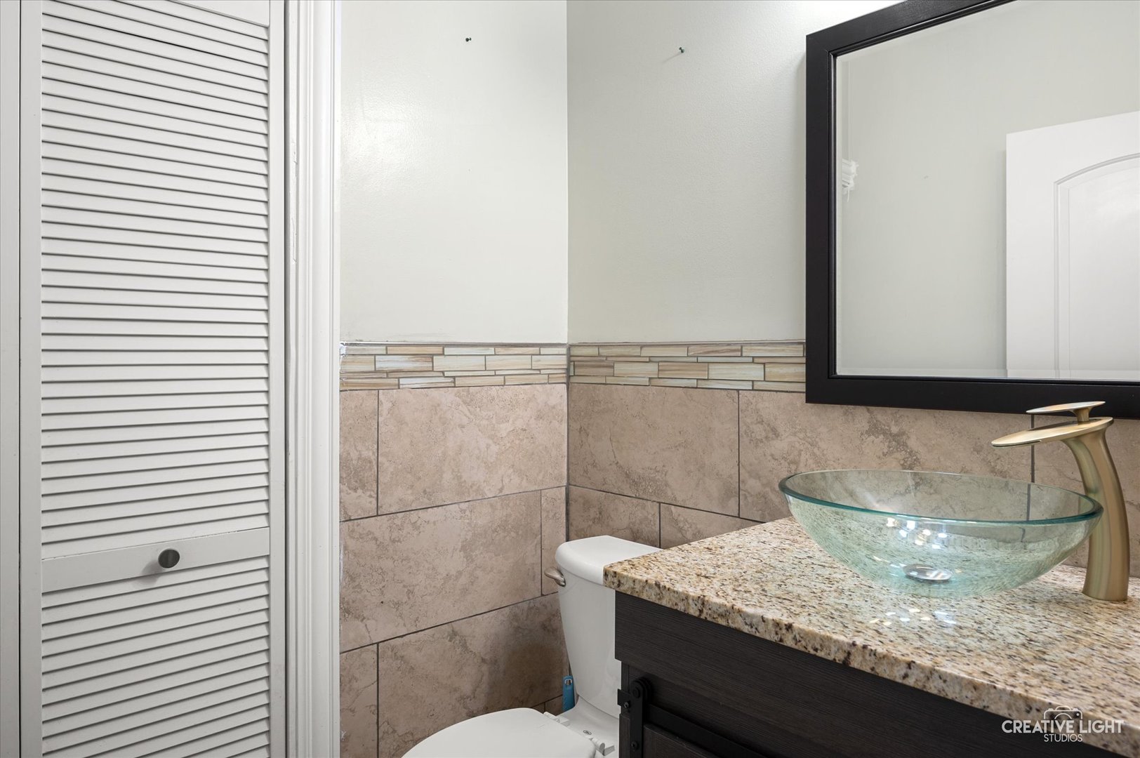 179 Azalea Circle, Unit 179 Romeoville, IL 60446 - Photo 7 of 16 a bathroom with a granite countertop sink and a mirror