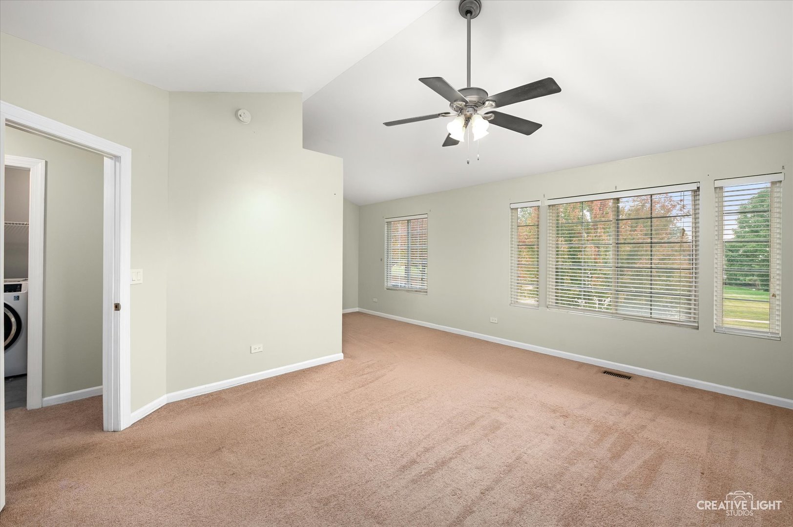 179 Azalea Circle, Unit 179 Romeoville, IL 60446 - Photo 8 of 16 a view of empty room with window and ceiling fan