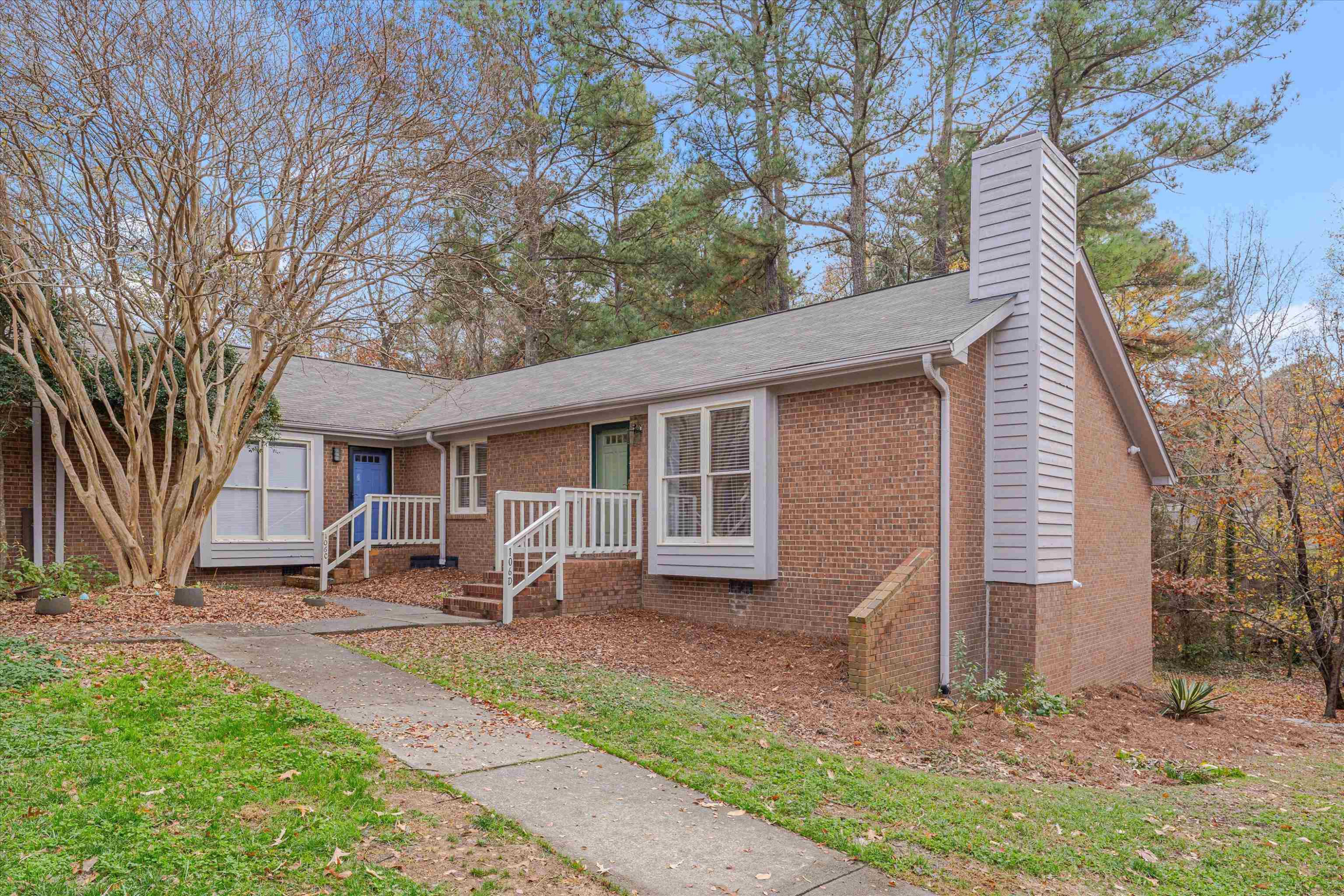 5500 Fortunes Ridge Drive, Unit 106D Durham, NC 27713 - Photo 1 of 30 a backyard of a house with table and chairs