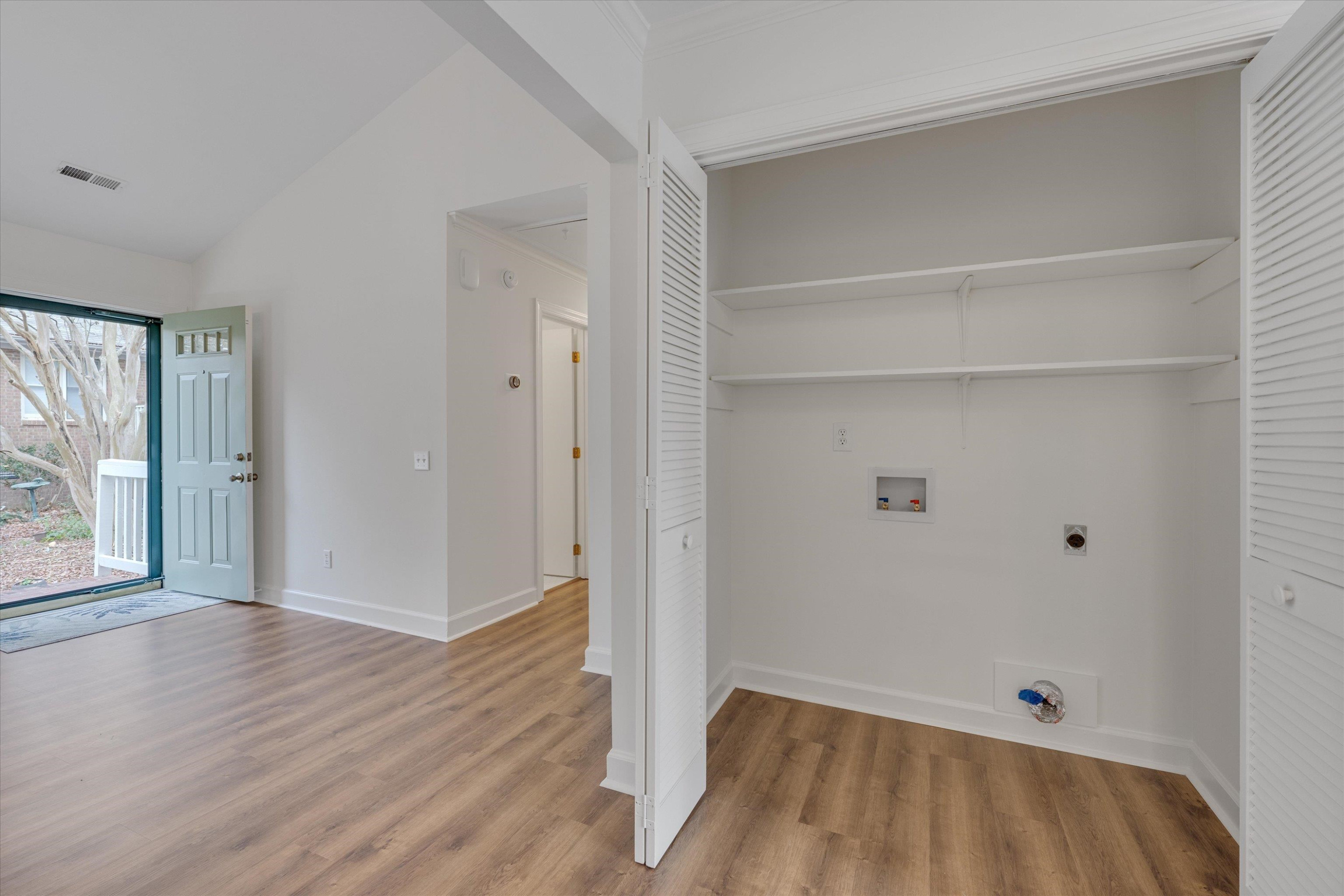 5500 Fortunes Ridge Drive, Unit 106D Durham, NC 27713 - Photo 16 of 30 a view of room with window and wooden floor