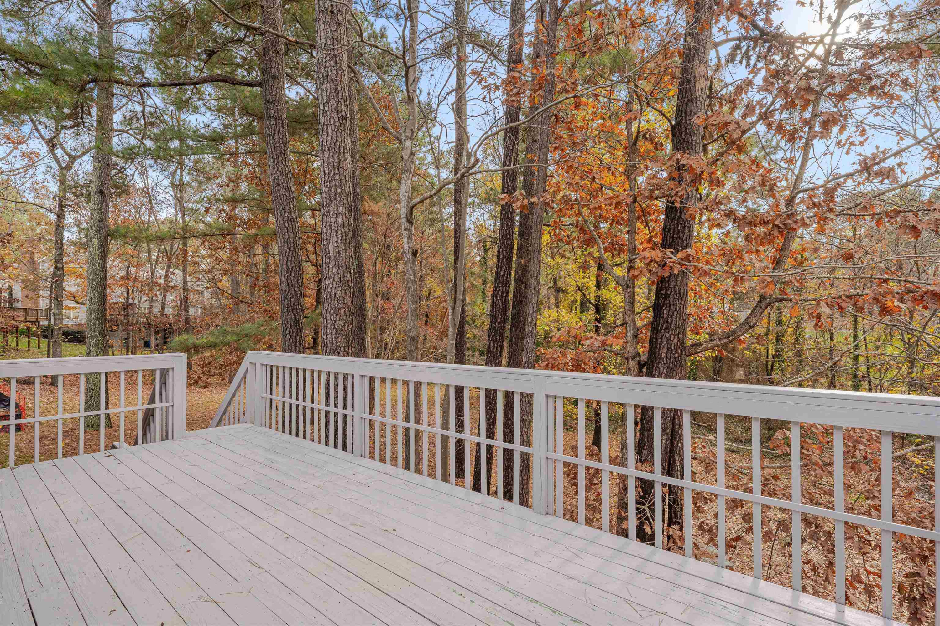 5500 Fortunes Ridge Drive, Unit 106D Durham, NC 27713 - Photo 27 of 30 a view of a wooden deck and a yard