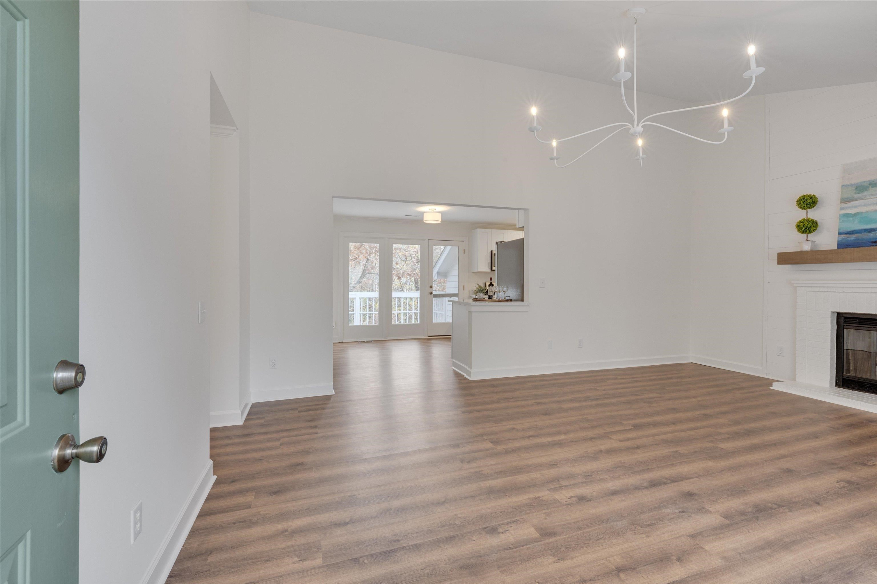 5500 Fortunes Ridge Drive, Unit 106D Durham, NC 27713 - Photo 4 of 30 a view of empty room with wooden floor