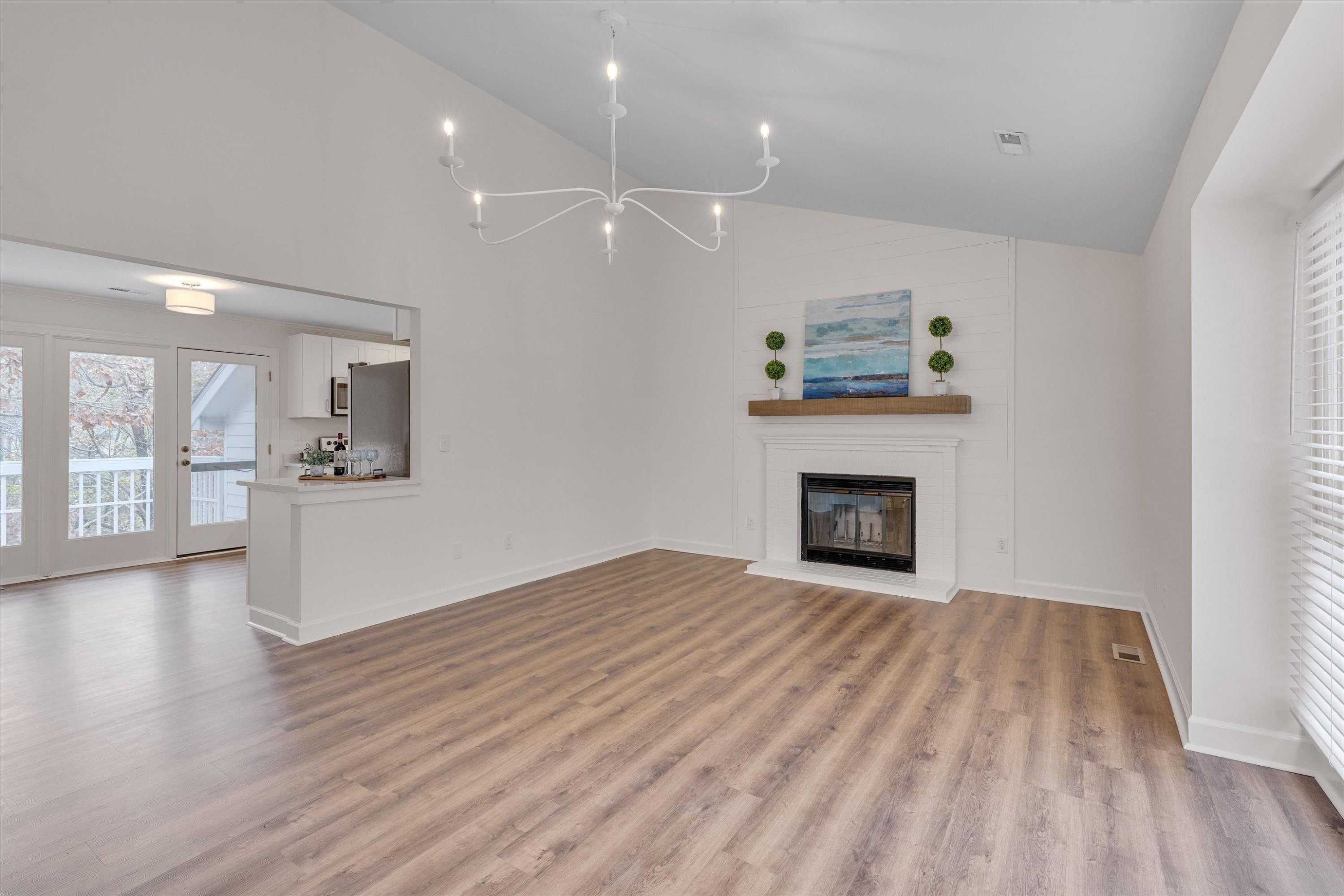 5500 Fortunes Ridge Drive, Unit 106D Durham, NC 27713 - Photo 6 of 30 a view of an empty room with a fireplace and a window
