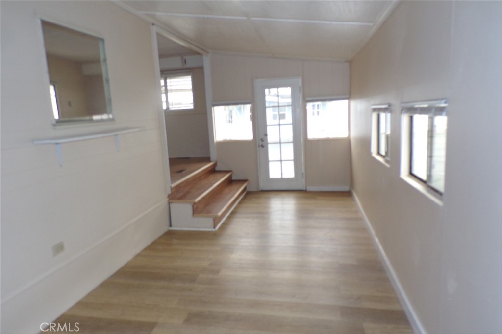 12710 3rd Street, Unit 57 Yucaipa, CA 92399 - Photo 4 of 13 a view of an empty room and glass door