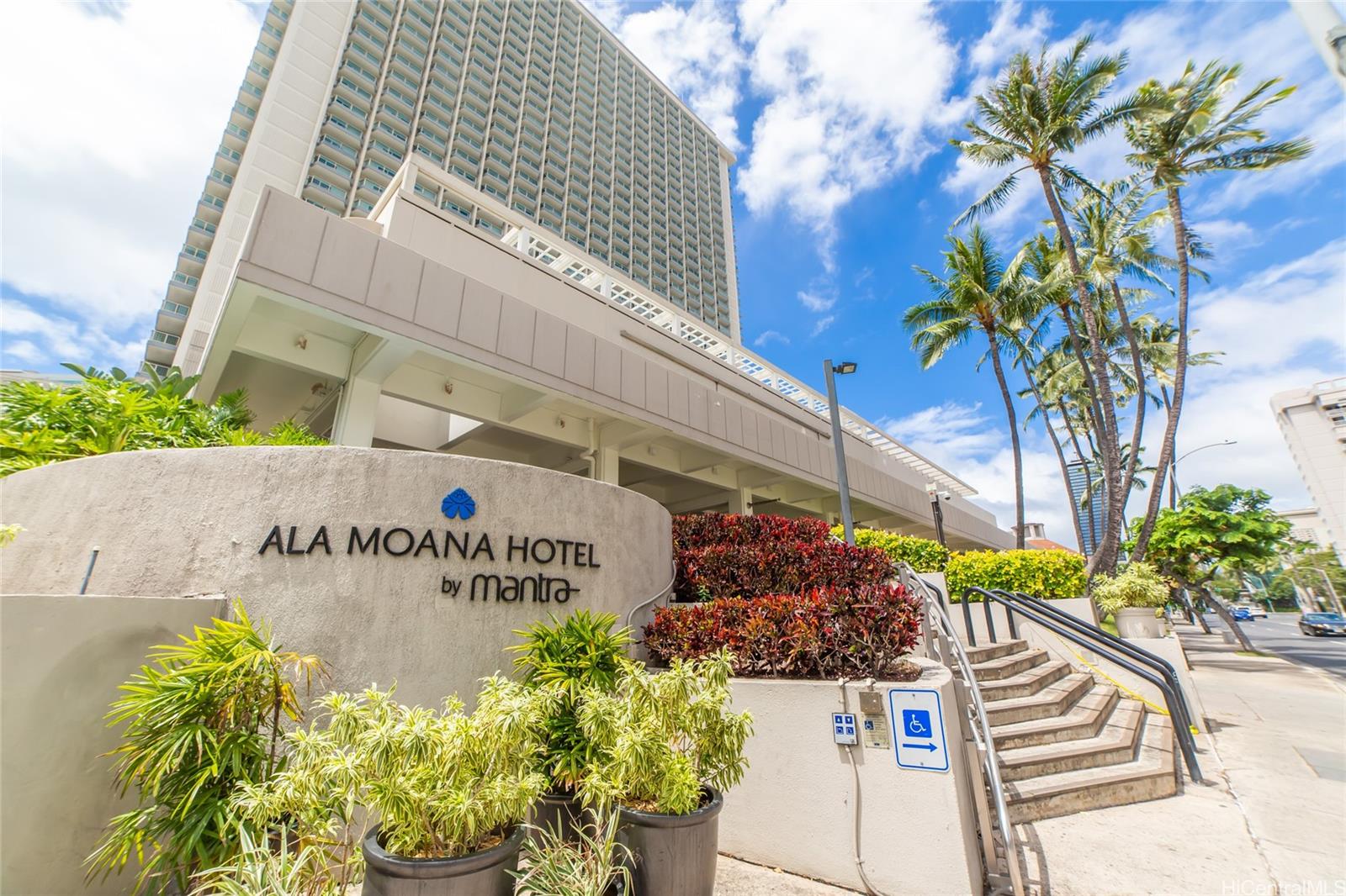 410 Atkinson Drive, Unit 930 Honolulu, HI 96814 - Photo 1 of 1 a sign that is sitting in front of flowers