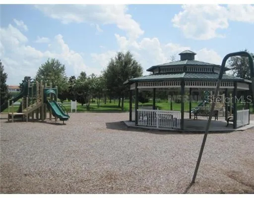 a view of a house with backyard and porch