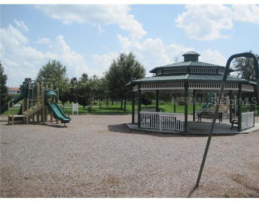7351 Millstone Street Windermere, FL 34786 - Photo 14 of 15 a view of a house with backyard and porch