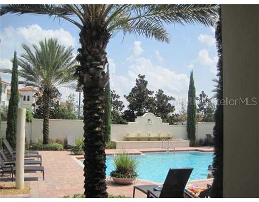 7351 Millstone Street Windermere, FL 34786 - Photo 15 of 15 a view of swimming pool with a yard and seating area