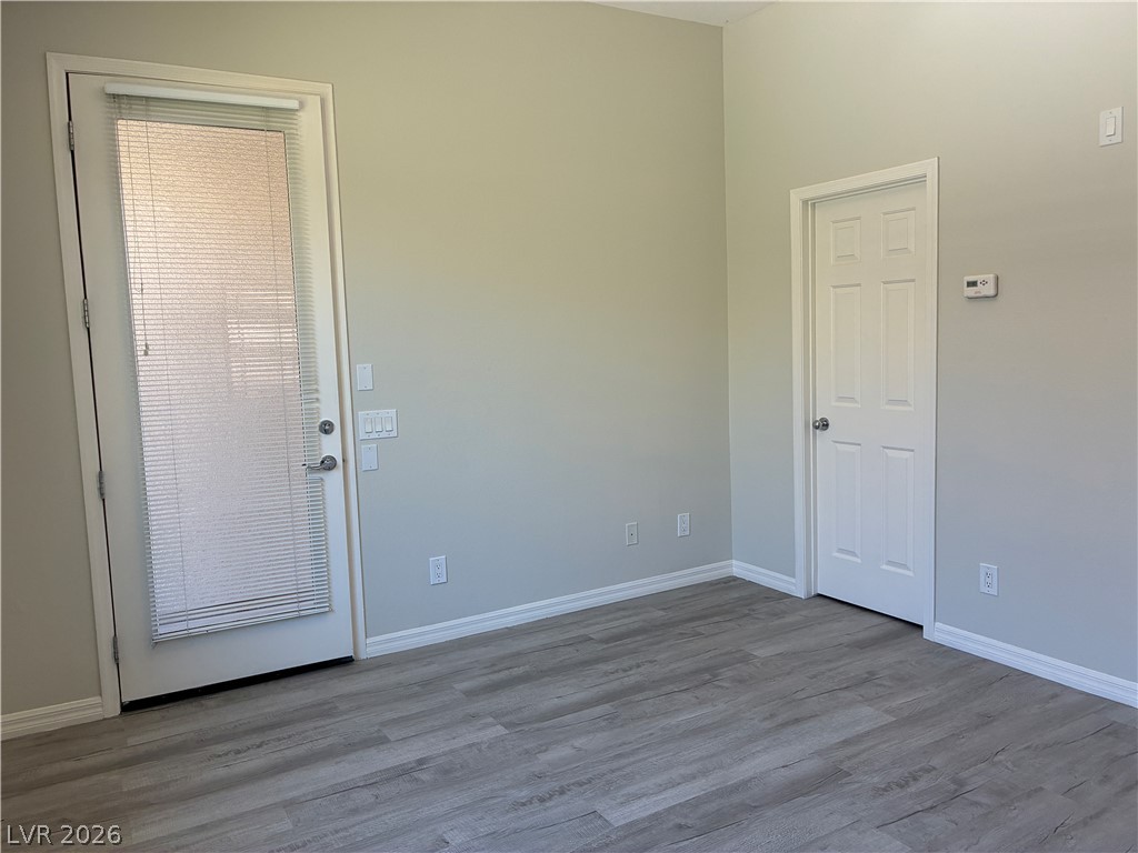 10 Caprington Road Henderson, NV 89052 - Photo 39 of 44 The tranquil space offers durable wood flooring and ample access through multiple doors.
