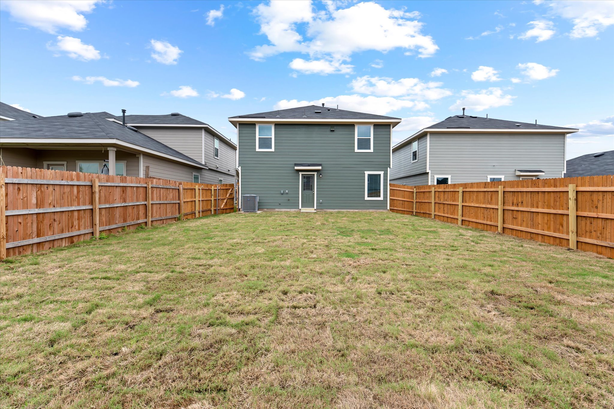 456 Sandringham Loop Kyle, TX 78640 - Photo 22 of 40 A fenced backyard offers a private outdoor sanctuary, perfect for relaxation and recreation.