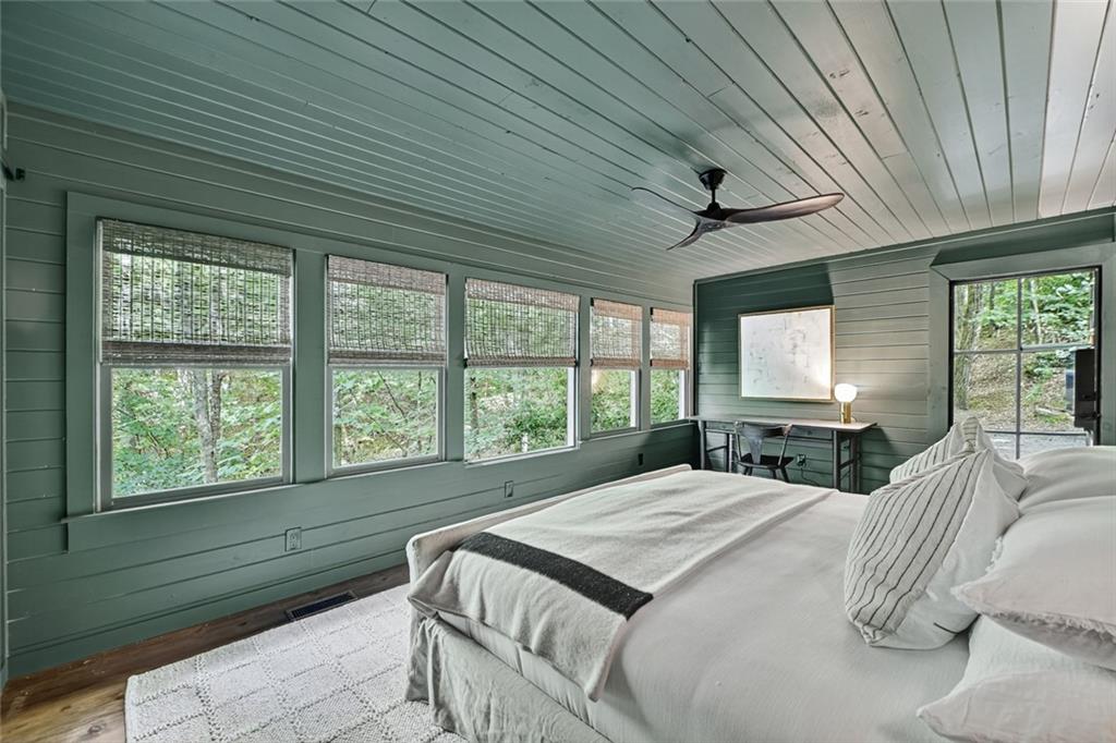 545 Chestnut Ridge Circle Blue Ridge, GA 30513 - Photo 17 of 34 a bedroom with a bed and a large window