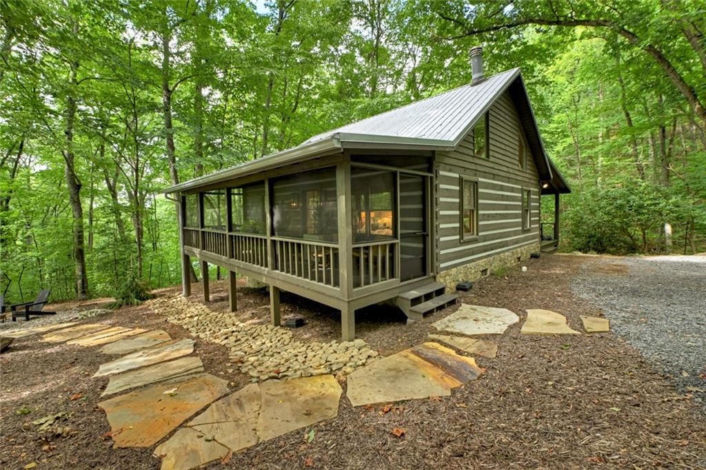 545 Chestnut Ridge Circle Blue Ridge, GA 30513 - Photo 2 of 34 a view of a small house with yard and sitting area