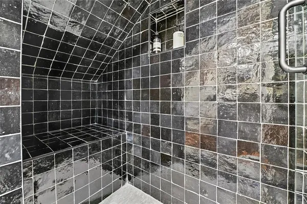 a bathroom with a black white checkered floor