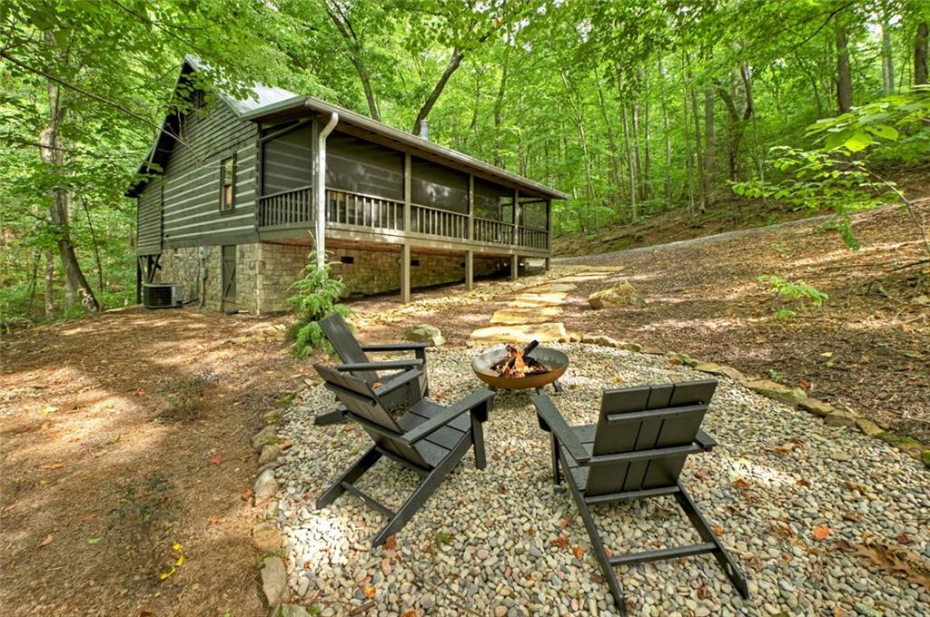 545 Chestnut Ridge Circle Blue Ridge, GA 30513 - Photo 32 of 34 a view of a house with backyard and sitting area