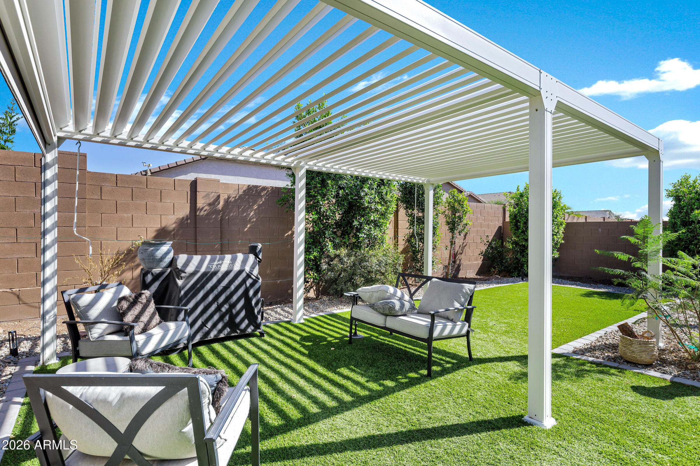 12243 East Sereno Road Gold Canyon, AZ 85118 - Photo 34 of 37 a view of chairs and table in patio with a backyard