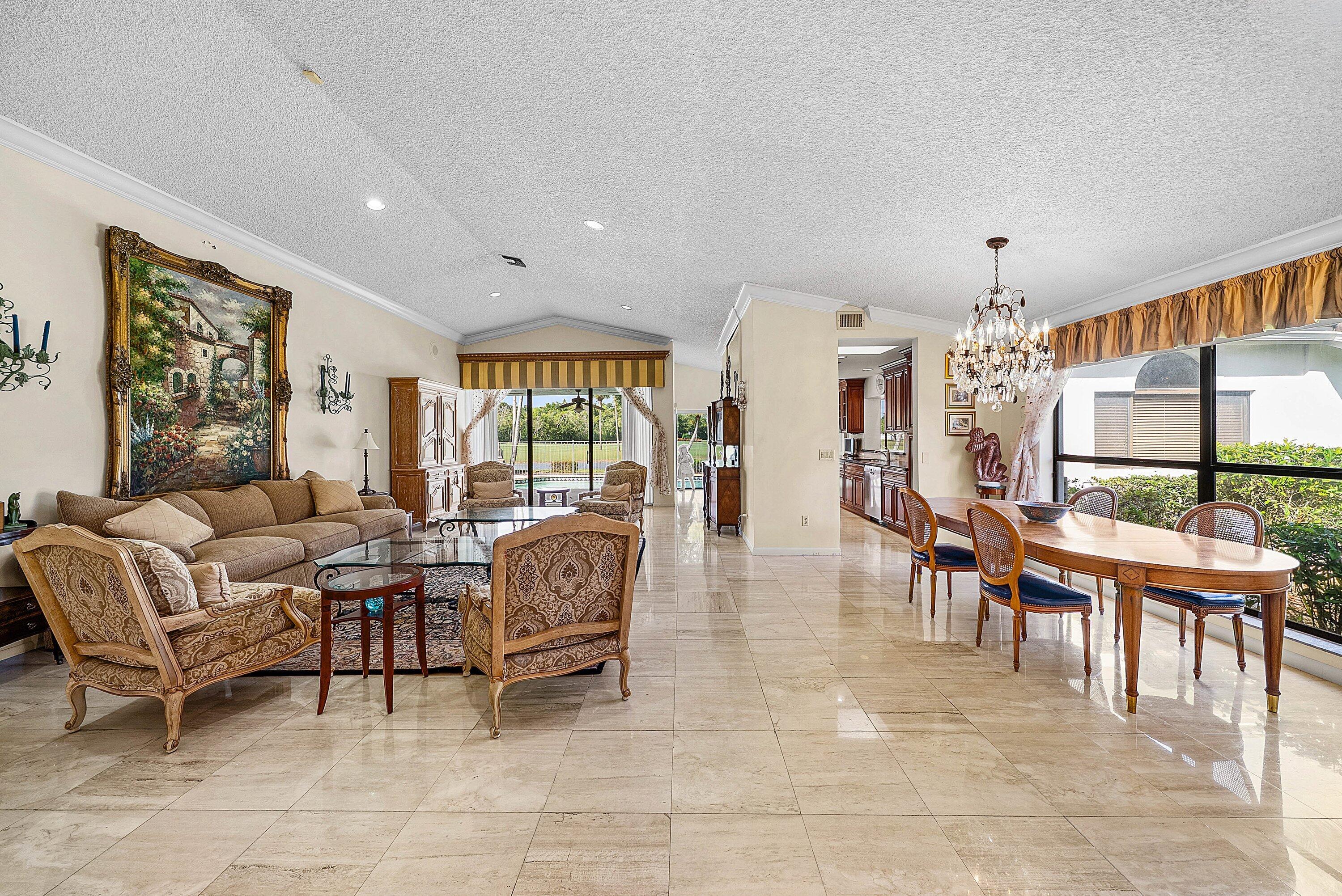 21459 Bridgeview Drive Boca Raton, FL 33428 - Photo 12 of 61 a living room with fireplace furniture and a large window