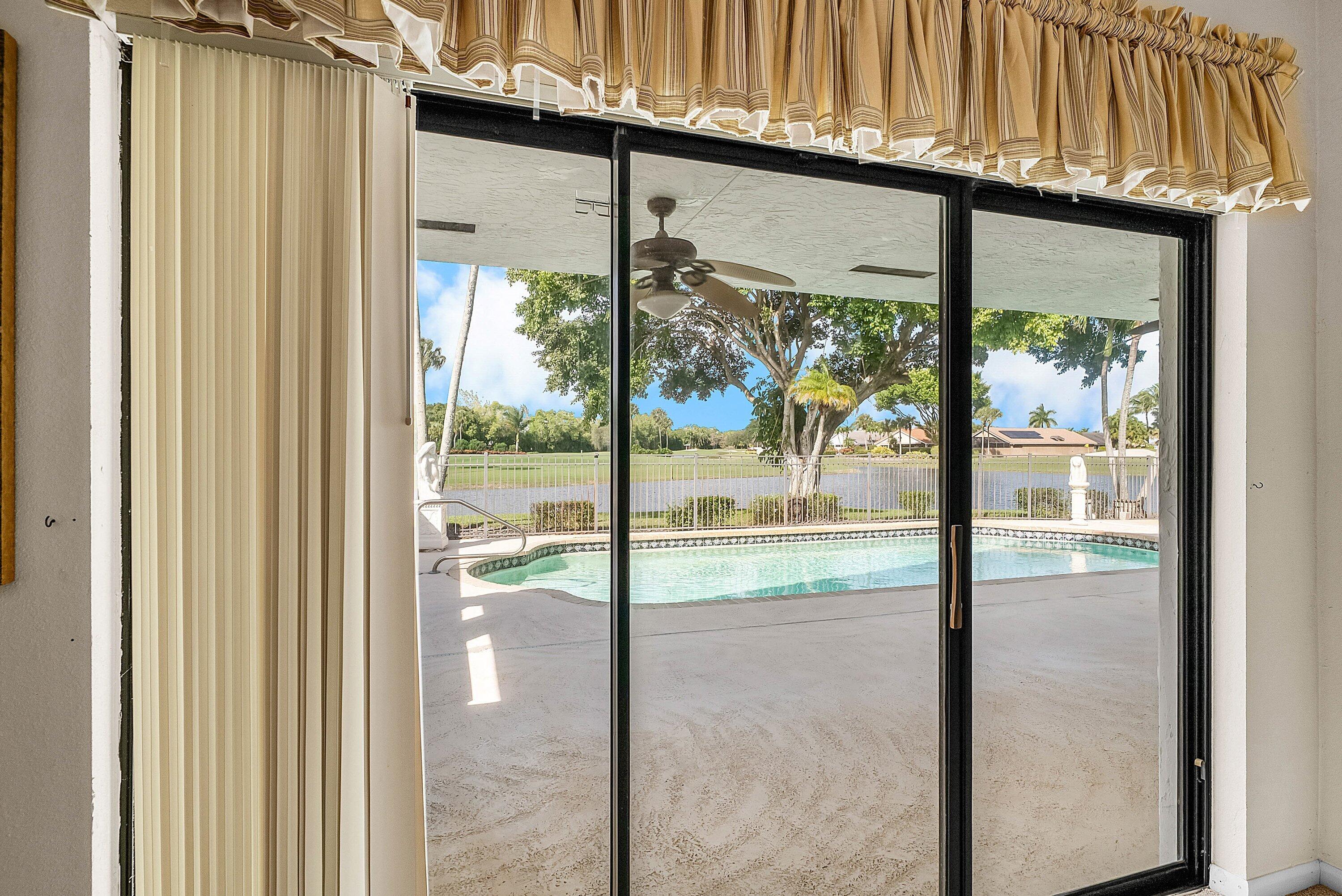 21459 Bridgeview Drive Boca Raton, FL 33428 - Photo 23 of 61 a view of a glass door with a balcony