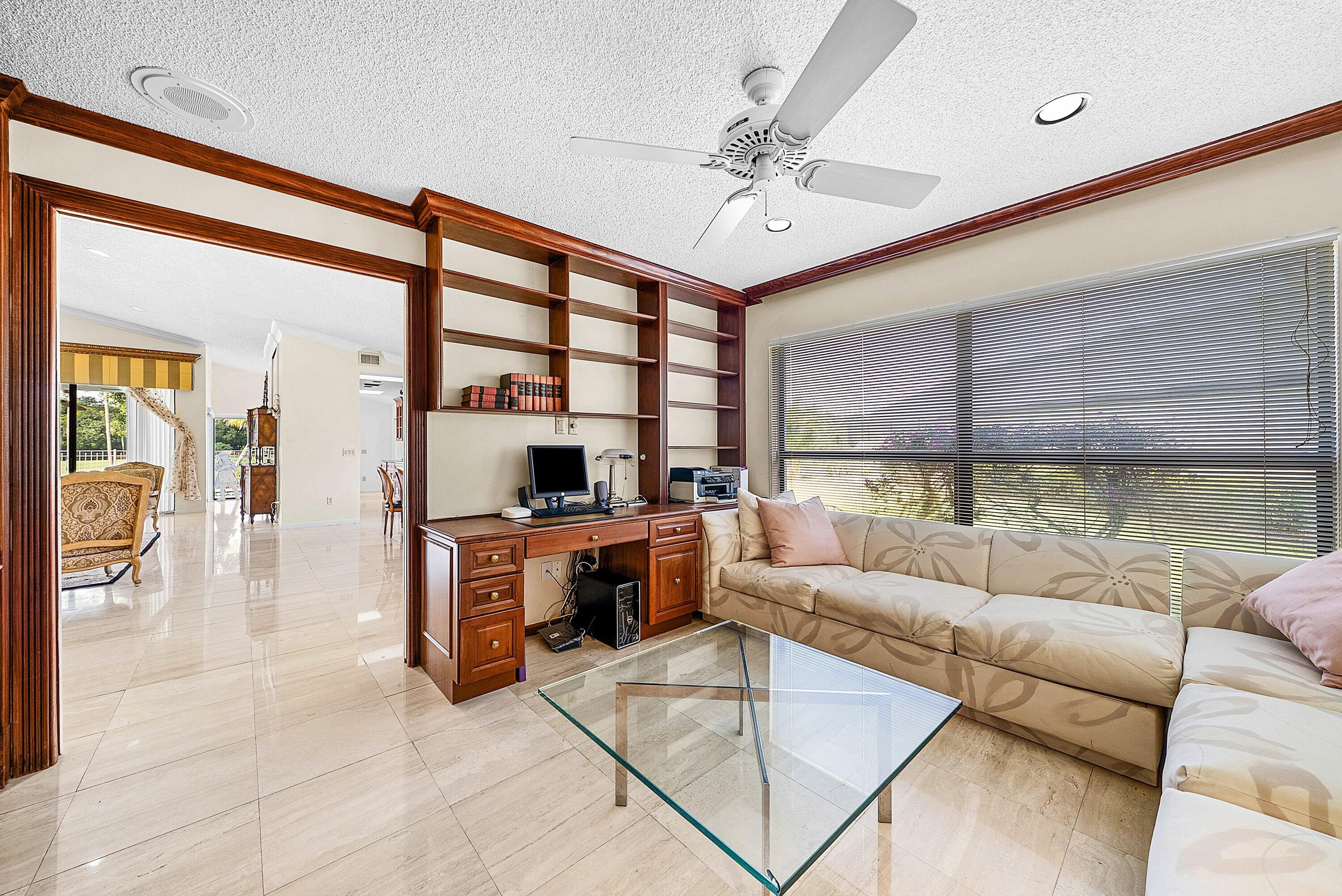 21459 Bridgeview Drive Boca Raton, FL 33428 - Photo 26 of 61 a living room with furniture and a large window