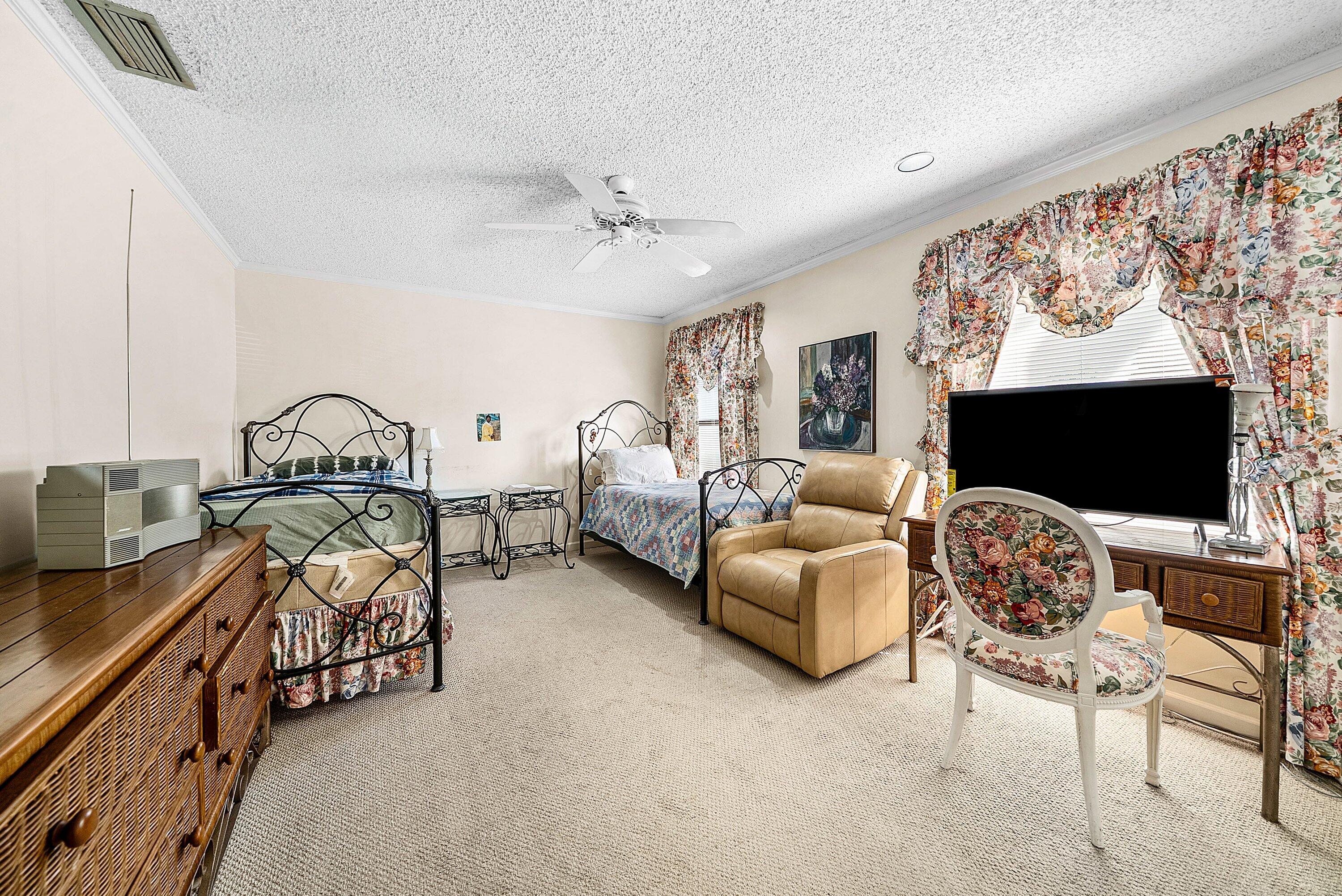 21459 Bridgeview Drive Boca Raton, FL 33428 - Photo 29 of 61 a living room with furniture and a flat screen tv