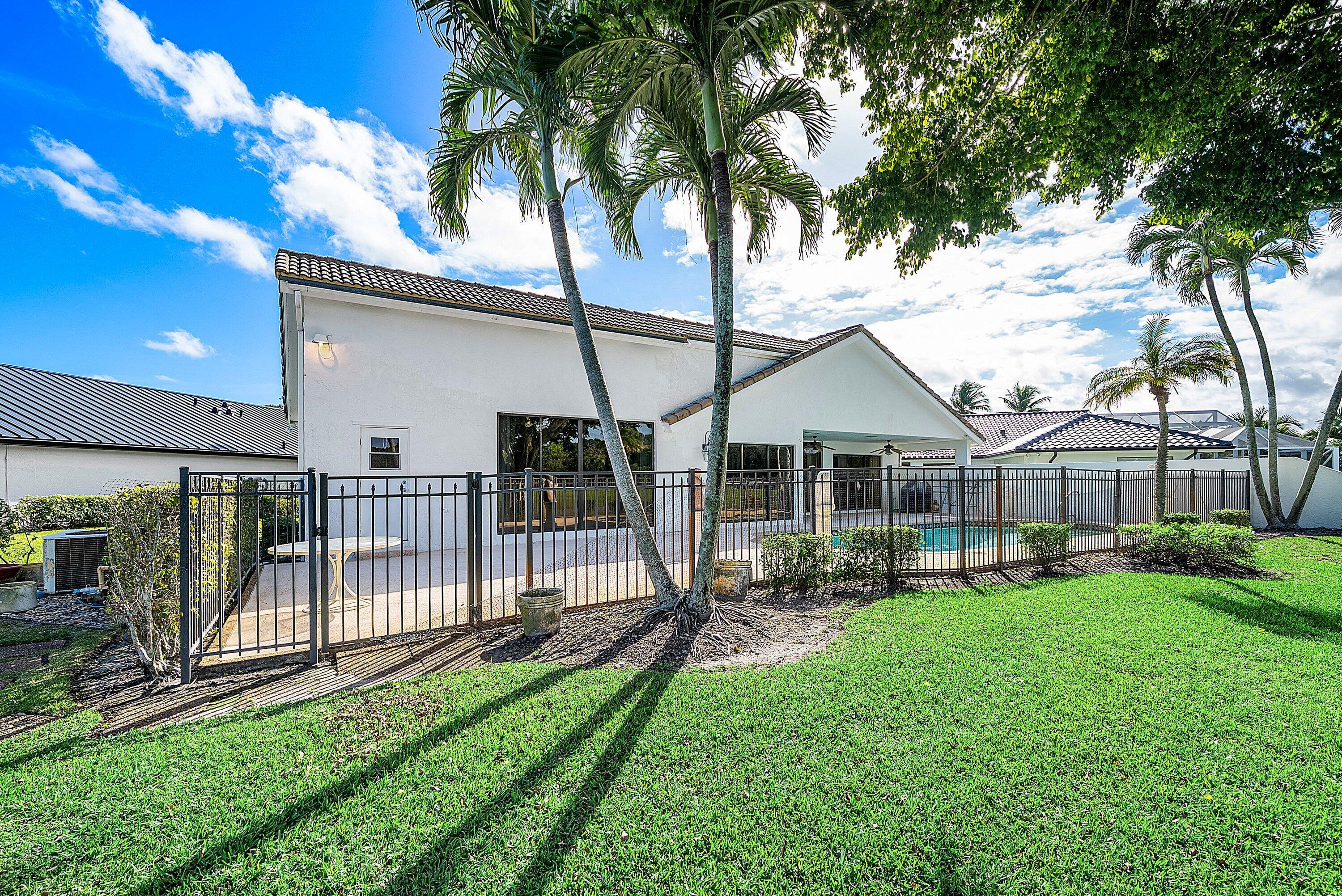 21459 Bridgeview Drive Boca Raton, FL 33428 - Photo 3 of 61 a view of a house with a yard and sitting area