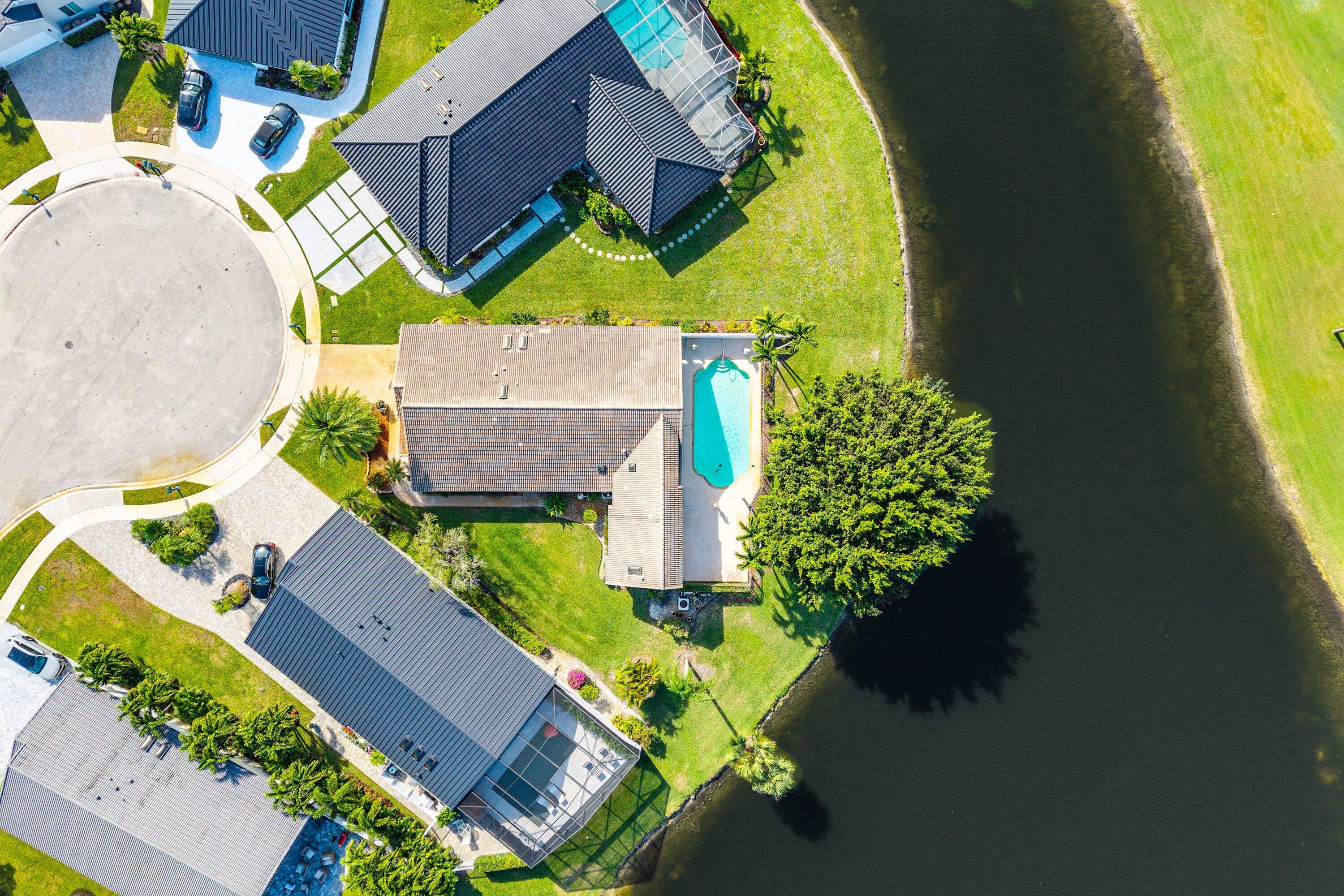 21459 Bridgeview Drive Boca Raton, FL 33428 - Photo 40 of 61 an aerial view of a house with a swimming pool and outdoor space