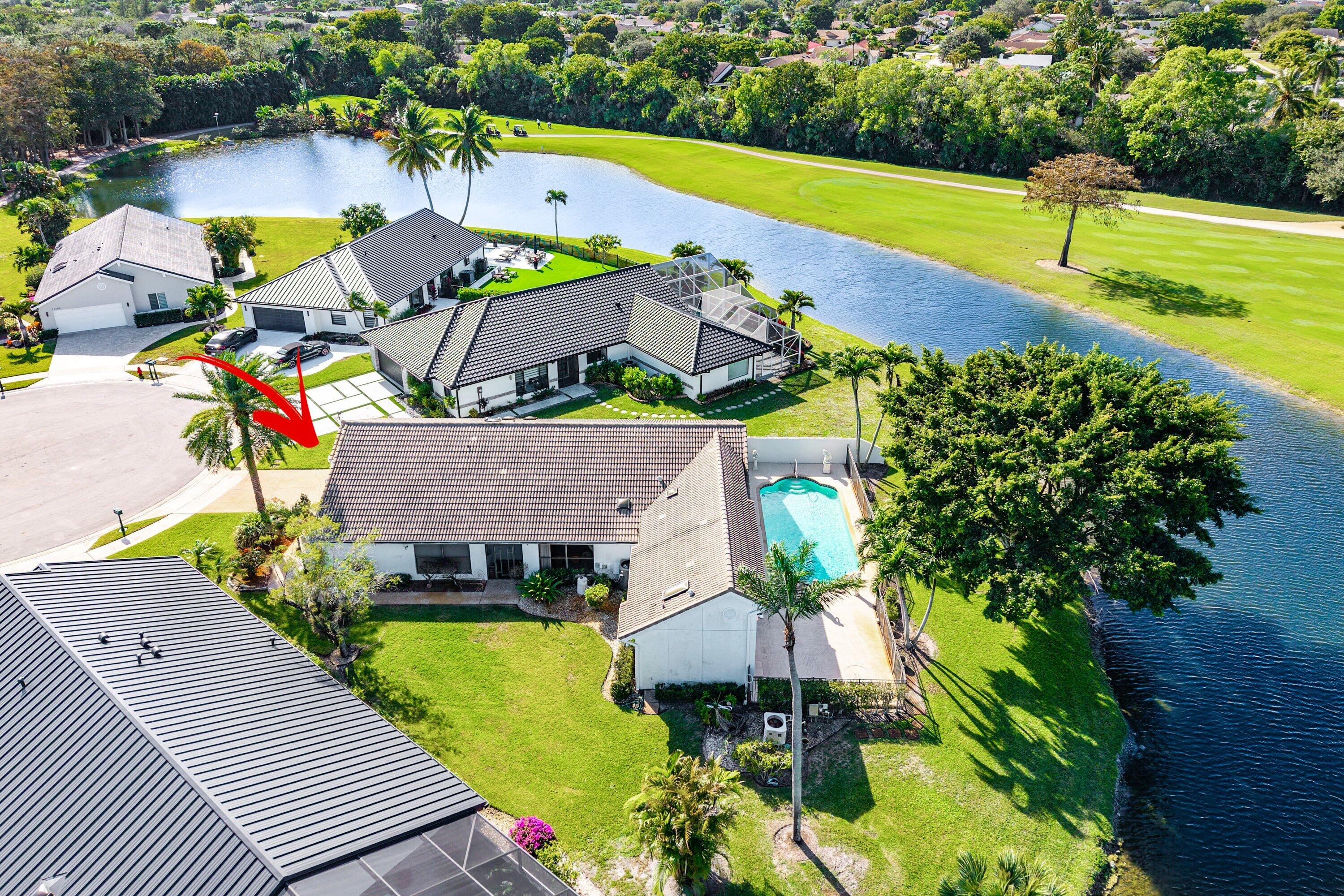 21459 Bridgeview Drive Boca Raton, FL 33428 - Photo 6 of 61 an aerial view of a house with a swimming pool a patio and yard