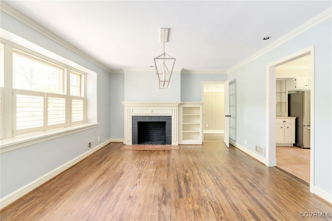 3925 Sherbrook Road Richmond, VA 23235 - Photo 7 of 49 Front room w/ chandelier, Wood burning FP