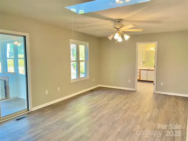a bathroom with a tub sink and window