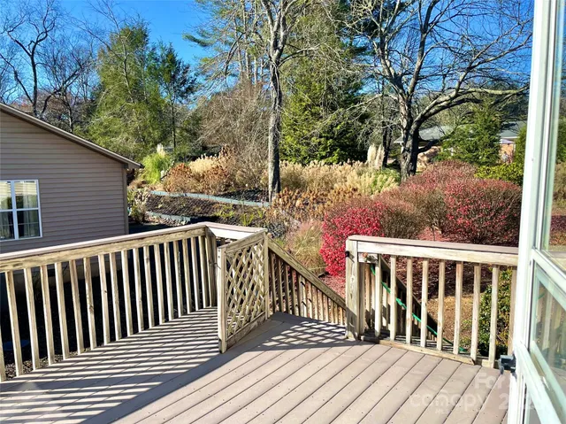 a view of backyard with swimming pool