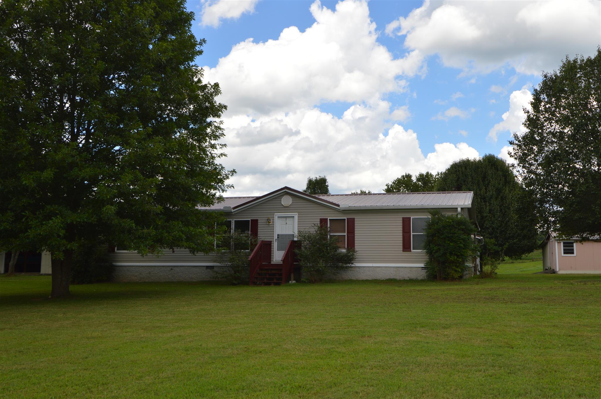 4579 Beech Log Road Lebanon, TN 37090 - Photo 1 of 30 a front view of a house with a garden