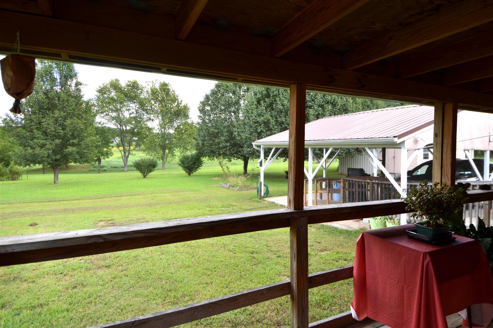 4579 Beech Log Road Lebanon, TN 37090 - Photo 17 of 30 a view of a porch with furniture and garden