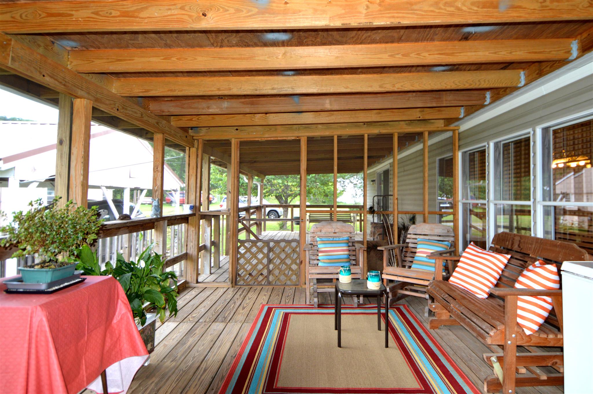 4579 Beech Log Road Lebanon, TN 37090 - Photo 18 of 30 a balcony with wooden floor and furniture