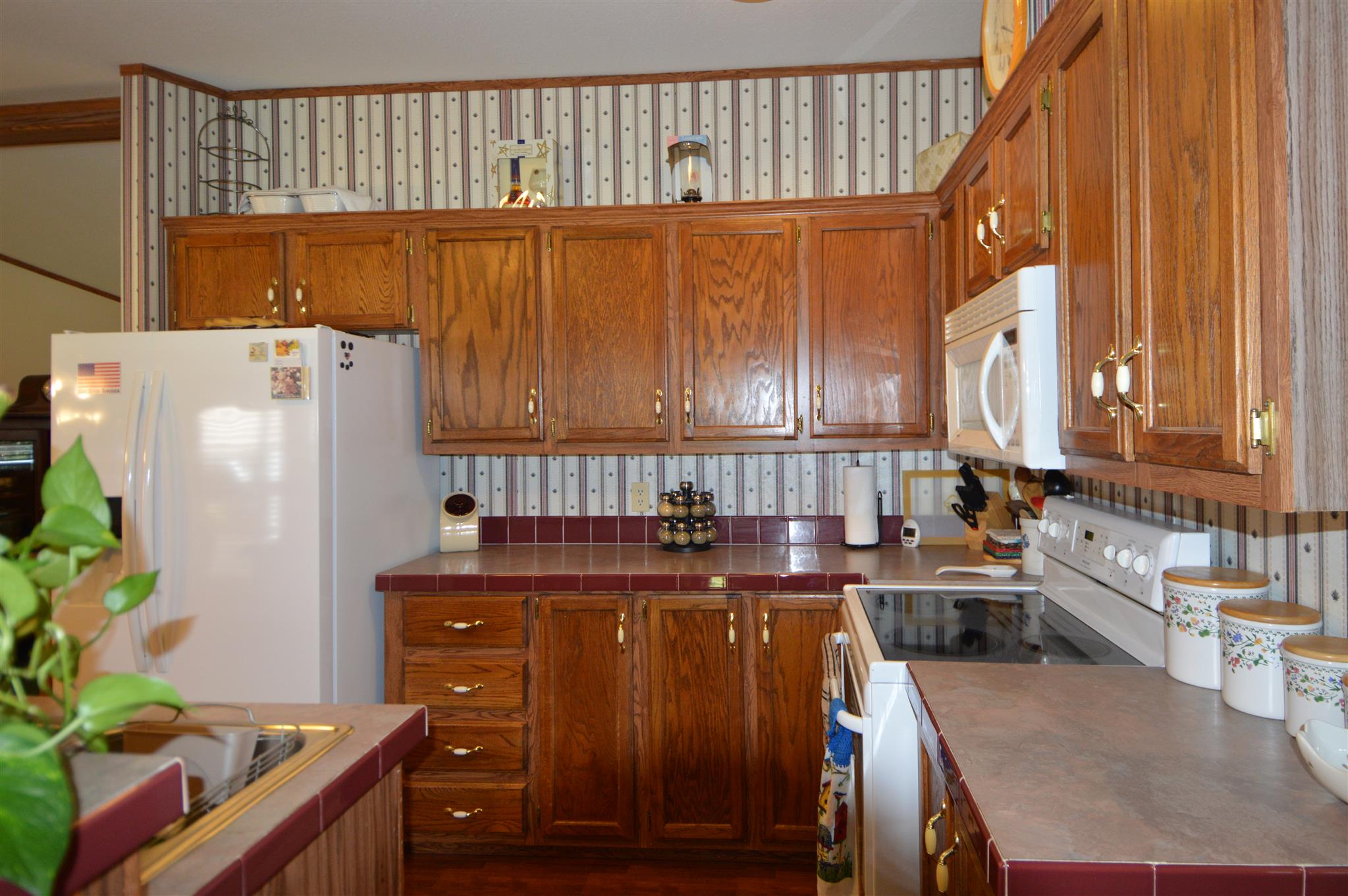 4579 Beech Log Road Lebanon, TN 37090 - Photo 5 of 30 a kitchen with stainless steel appliances granite countertop a refrigerator a sink and a stove