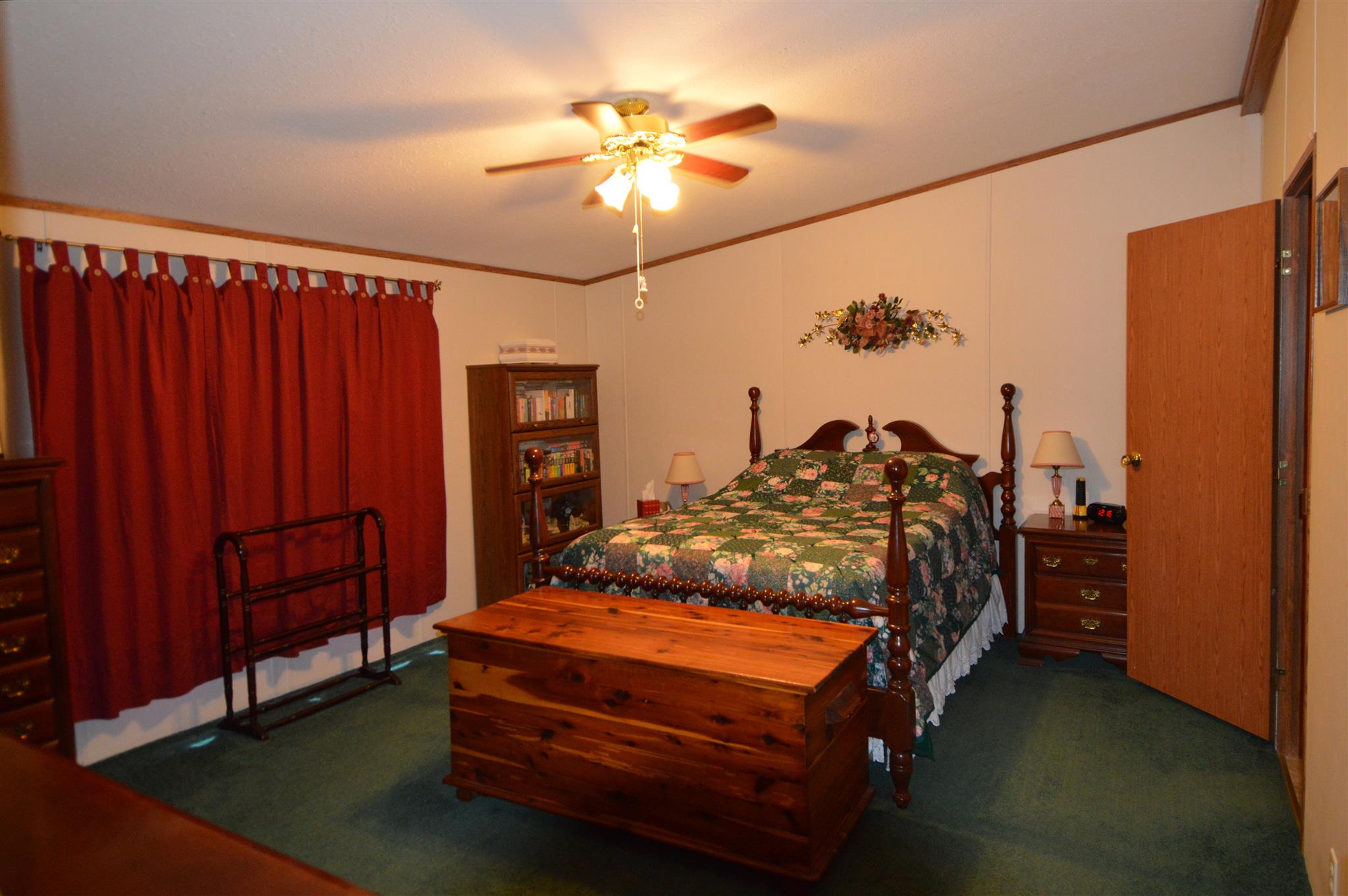 4579 Beech Log Road Lebanon, TN 37090 - Photo 8 of 30 a bed sitting in a bedroom next to a chandelier