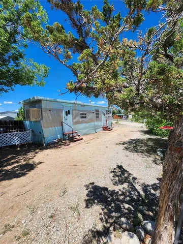 a view of a house with a snow on the road