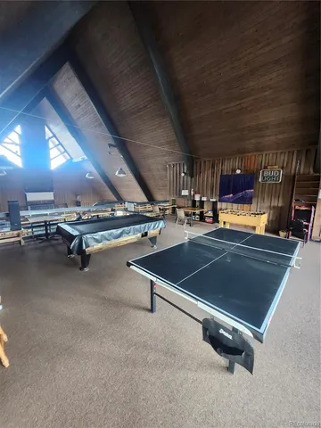 a view of a gym with pool table