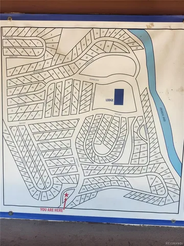 a view of a door with a white car and a window