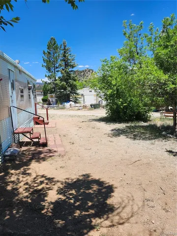 a view of a backyard of the house