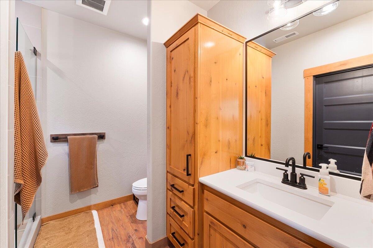 2220 Butte Falls Highway Eagle Point, OR 97524 - Photo 36 of 69 a bathroom with a sink a toilet and shower