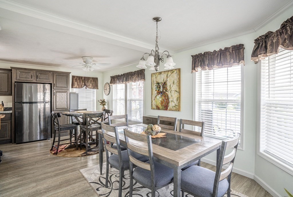 18 Linsay Drive Raynham, MA 02767 - Photo 13 of 41 a view of a dining room with furniture window and wooden floor