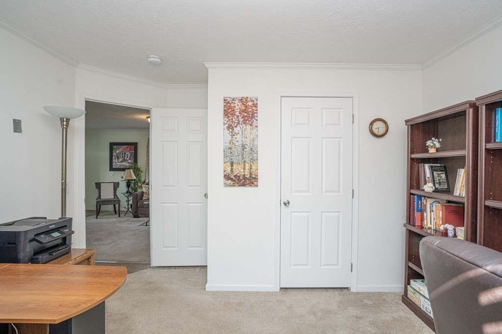 18 Linsay Drive Raynham, MA 02767 - Photo 18 of 41 a view of a livingroom with furniture and cabinet