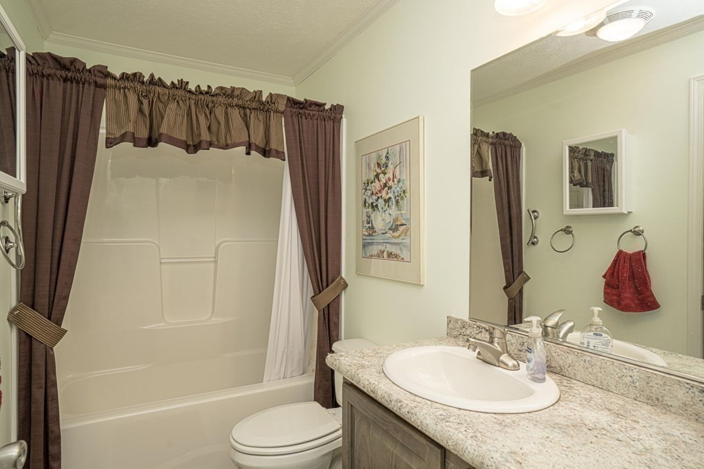 18 Linsay Drive Raynham, MA 02767 - Photo 22 of 41 a bathroom with a granite countertop sink toilet and shower