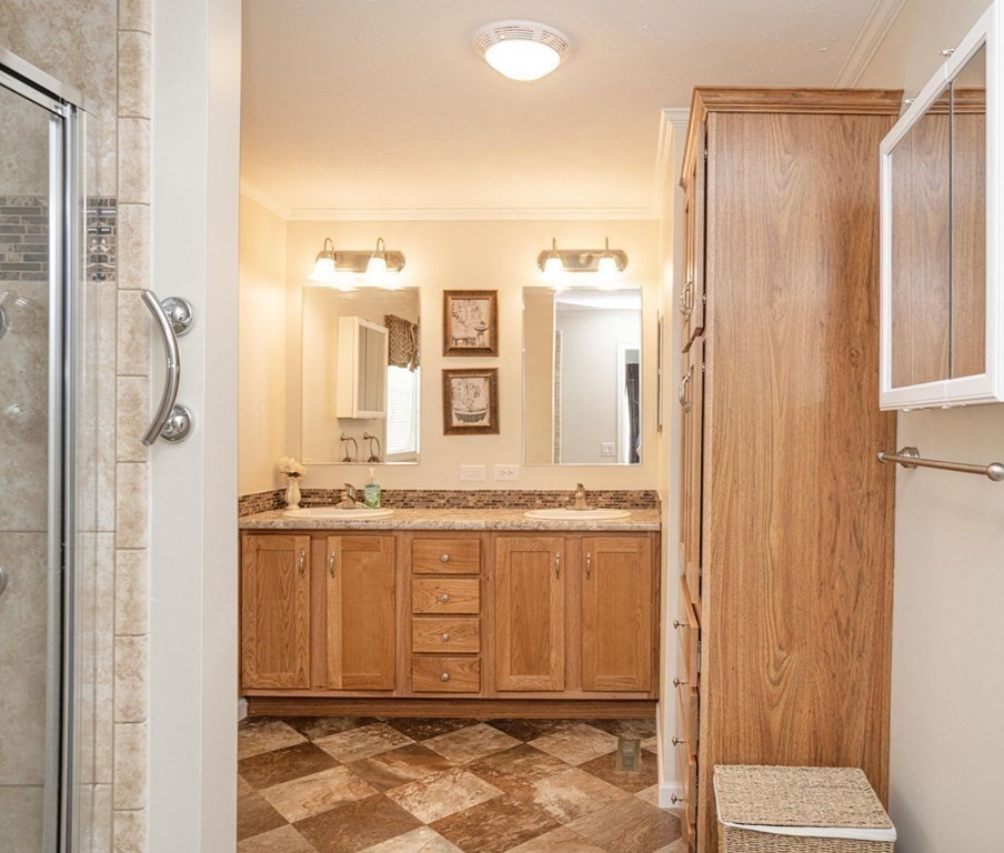 18 Linsay Drive Raynham, MA 02767 - Photo 29 of 41 a bathroom with a granite countertop sink and a mirror