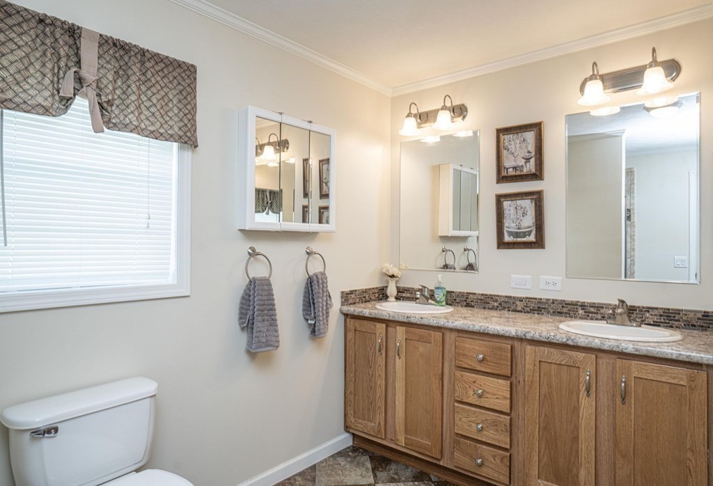 18 Linsay Drive Raynham, MA 02767 - Photo 30 of 41 a bathroom with a granite countertop sink toilet and mirror