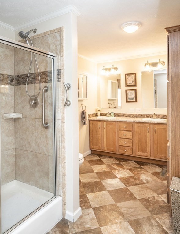 18 Linsay Drive Raynham, MA 02767 - Photo 31 of 41 a bathroom with a tub shower and sink