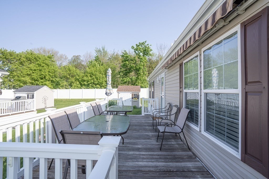 18 Linsay Drive Raynham, MA 02767 - Photo 35 of 41 a view of balcony with furniture and trees