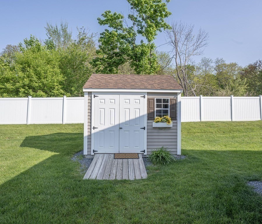 18 Linsay Drive Raynham, MA 02767 - Photo 36 of 41 a front view of house with yard and green space