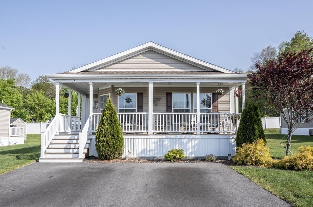 18 Linsay Drive Raynham, MA 02767 - Photo 39 of 41 a view of a house with a small yard and plants
