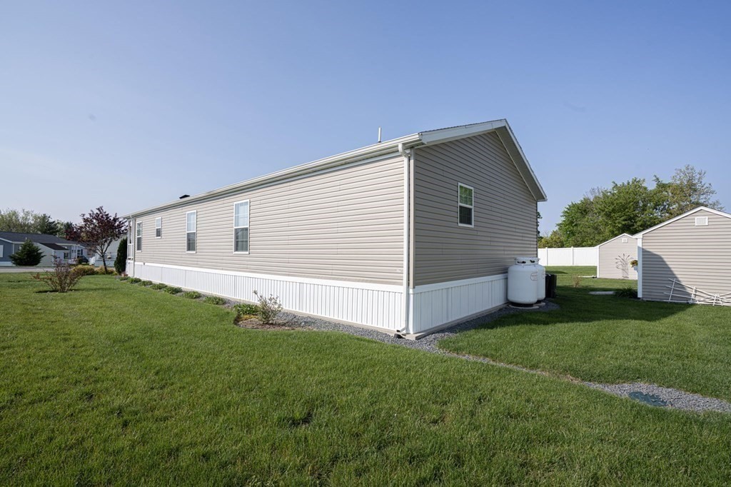 18 Linsay Drive Raynham, MA 02767 - Photo 41 of 41 a view of a backyard with house